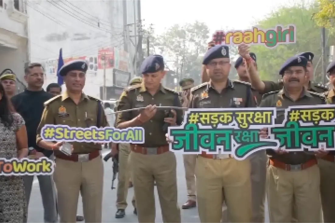 Police officers holding road safety campaign props