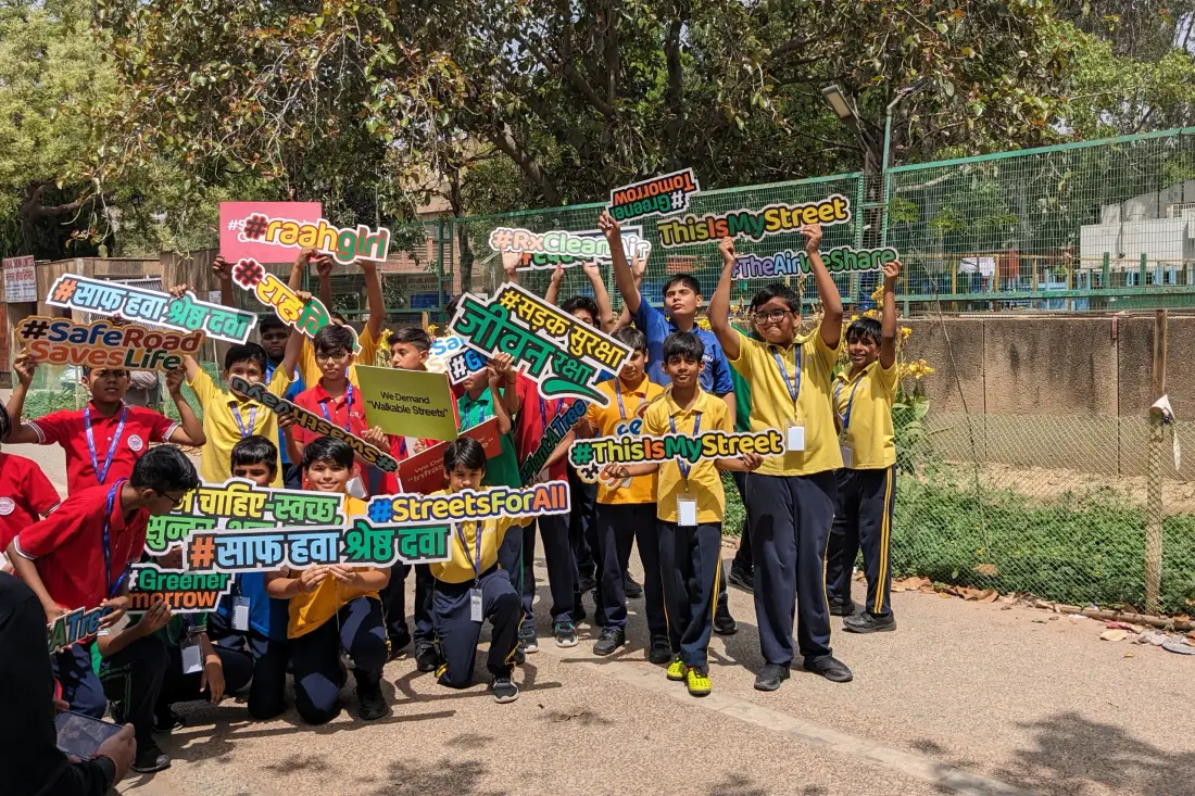 School children holding road safety placards