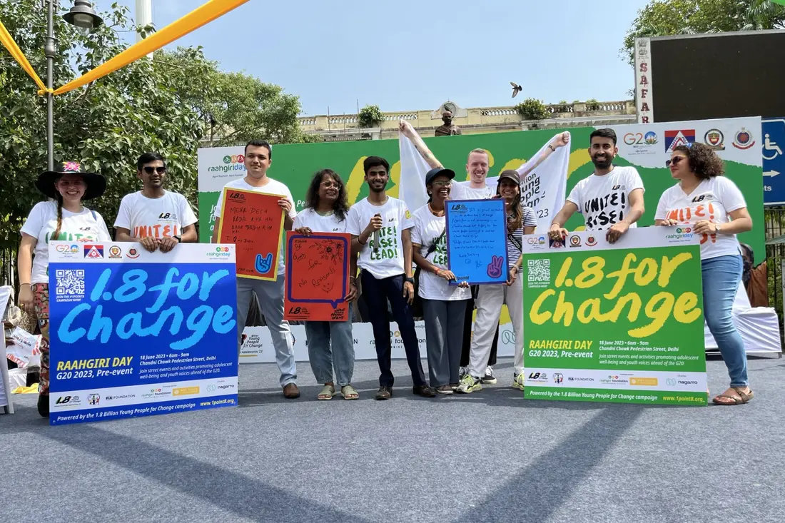 Young people holding placards calling for change