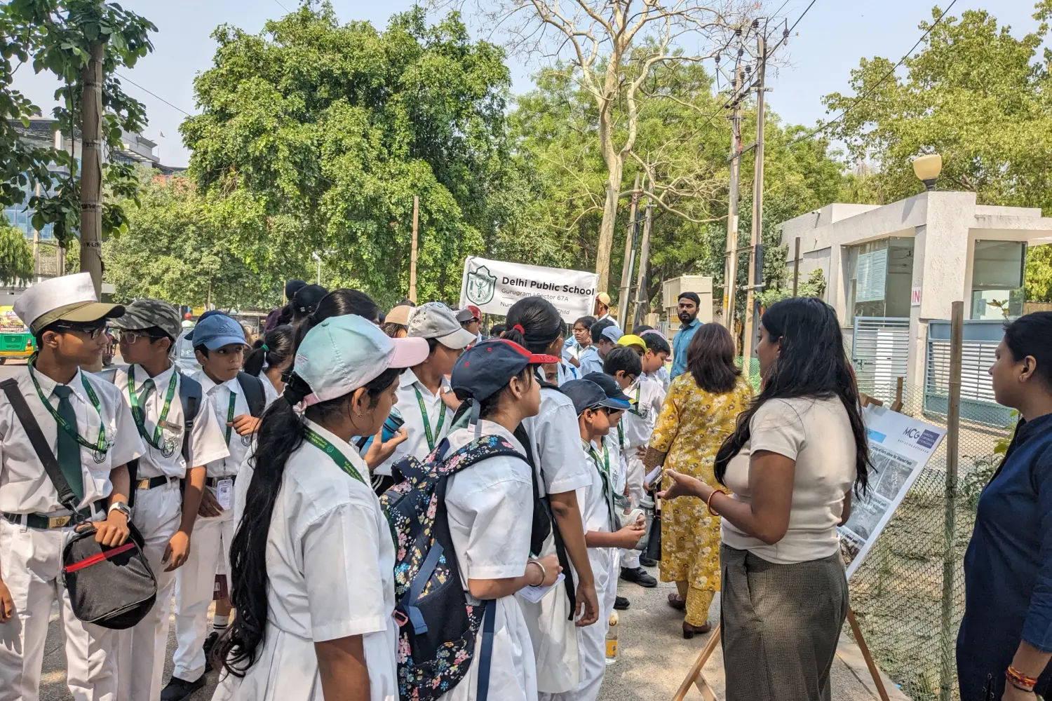 School students and city officials walking a neighbourhood together during a walk-shop