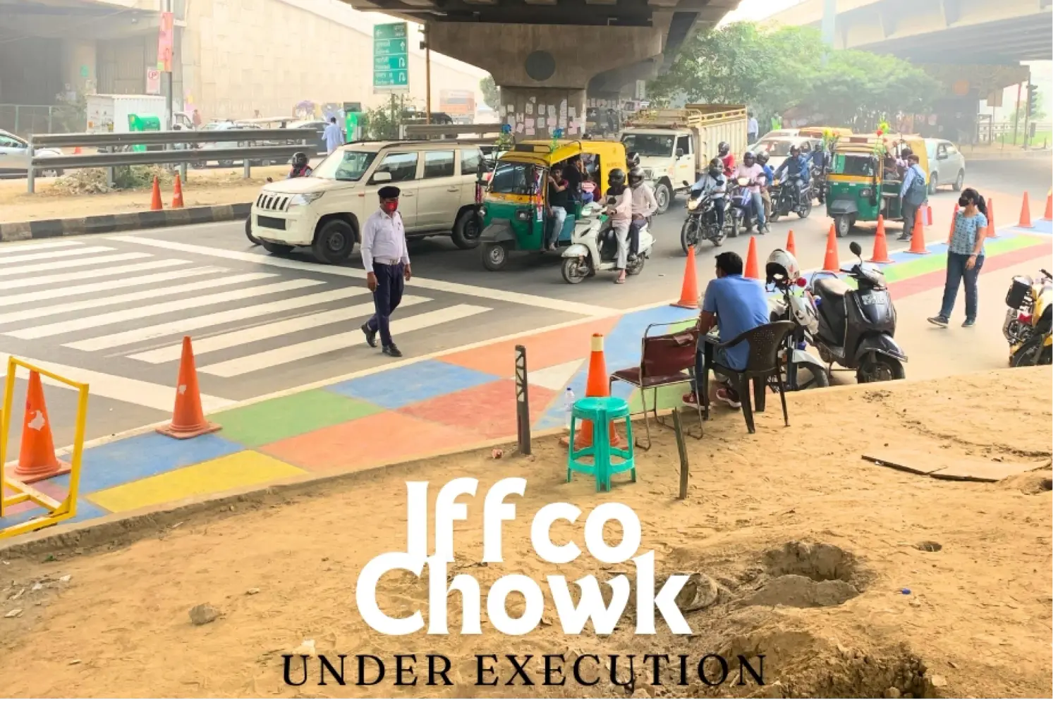 A junction marked out with cones and colourful paint during a road safety trial